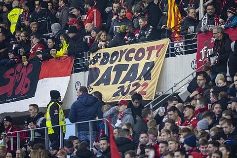 A placard with the inscription 'Boycott Qatar 2022' seen in the SC Freiburg fan block before the Bundesliga soccer match at Europa-Park Stadion, Germany, Nov. 13, 2022. (Photo | AP)