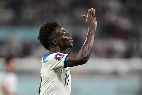SAGA! Bukayo Saka celebrates after scoring his side's fourth goal against Iran during the World Cup group B soccer match at the Khalifa International Stadium, in Doha, Nov. 21, 2022. (Photo | AP)