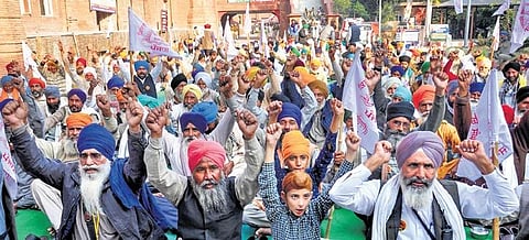 Farmers under the banner of Kisan Mazdoor Sangharsh Committee protest against the Central government in Amritsar on Saturday. (Photo| PTI)