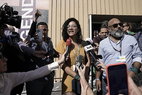 Sanaa Seif, sister of Alaa Abdel-Fattah, who is on a hunger and water strike, speaks to members of the media at the COP27 U.N. Climate Summit, Nov. 8, 2022, in Sharm el-Sheikh, Egypt. (Photo | AP)