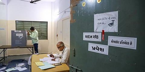 Preparations at a polling station for the first phase of Gujarat Assembly elections, in Rajkot. (Photo | PTI)