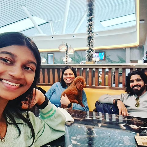 The family in a cheerful mood at KIA after getting the boarding pass for their poodle. They were shocked to learn later it could not travel.
