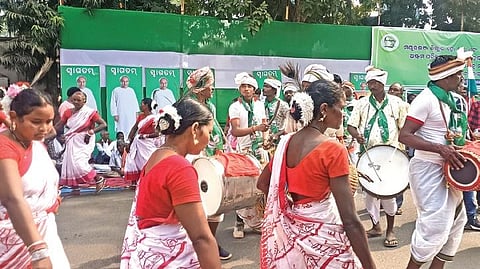 Tribals dancing to traditional music in front of the collector’s office | Express