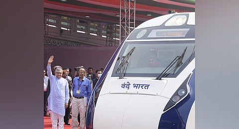 Railways Minister Ashwini Vaishnaw stands near Vande Bharat Express train before its flagging off ceremony, at Howrah railway station in Kolkata (Photo | PTI)