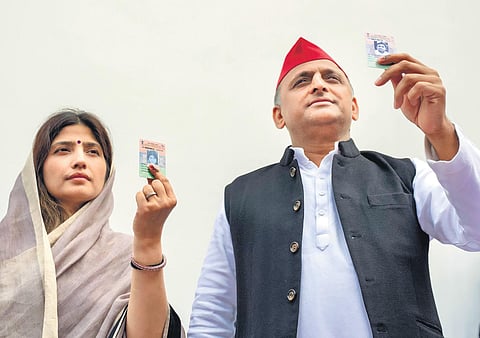SP president Akhilesh Yadav and his wife and party candidate Dimple Yadav after casting their votes at Saifai in Etawah district on Monday | PTI