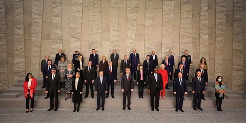 NATO defense ministers pose during a group photo at NATO headquarters in Brussels. (Photo | AP)
