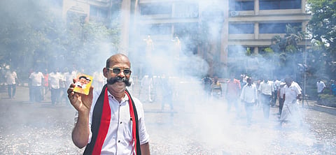 Crackers and sweets mark celebration at the DMK office