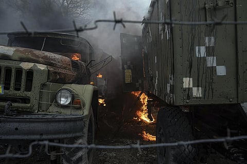 Ukrainian military track burns at an air defence base in the aftermath of an apparent Russian strike in Mariupol, Ukraine, Thursday, Feb. 24, 2022. (Photo | AP)
