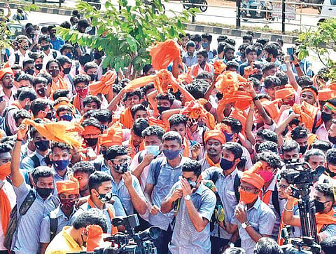 Two groups of students, wearing saffron stoles and turbans. (File Photo)