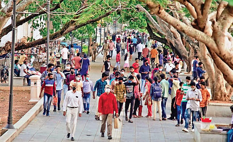 As the number of Covid cases records a dip in Kerala, people flock to the popular tourist spot of Marine Drive in Kochi | (Photo | EPS, Albin Mathew)