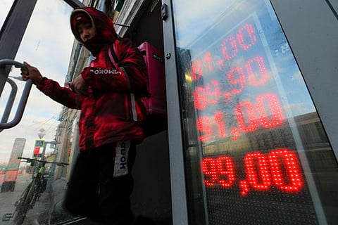 The ruble plunged to a record low of less than 1 U.S. cent in value Monday after Russia was cut off from the global bank payments system in retaliation for Moscow’s invasion of Ukraine. (Photo | AP)