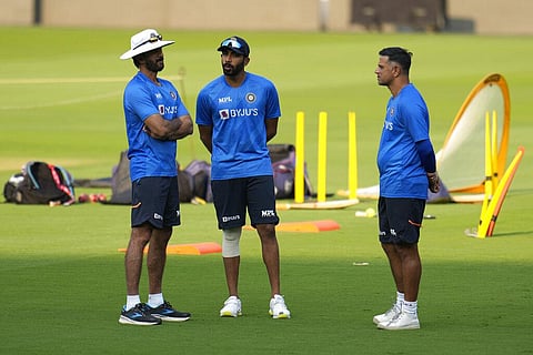 India's vice captain Jasprit Bumrah, center, interacts with batting coach Vikram Rathour, left, and head coach Rahul Dravid during a training session ahead of the second Test against Sl. (Photo | AP)