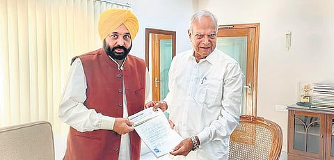 Bhagwant Mann meets Governor Banwarilal Purohit to stake claim for forming government in Punjab | PTI