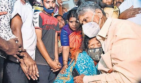 TDP chief N Chandrababu Naidu consoles a woman whose relative allegedly died due to consumption of adulterated liquor in Jagareddygudem | Express