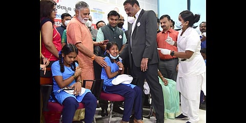 Children in the 12-14 age-group get their shots of the Corbevax vaccine at Atal Bihari Vajpayee Medical College, in Bengaluru.
