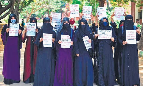 Students protest in front of a private college in Chamarajanagar on Wednesday