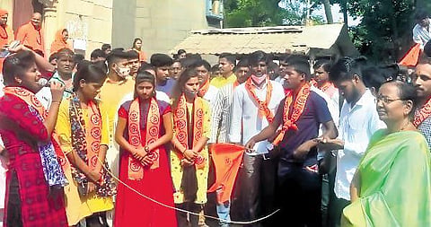 The district police booked a case against Bajrang Dal activist Pooja Veerashetty (extreme left with mic) for hate speech in Vijayapura | Express
