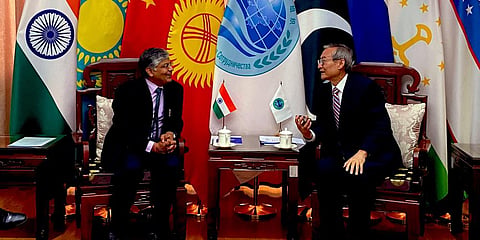 India's new Ambassador to China Pradeep K Rawat (L) and Shanghai Cooperation Organisation secretary-general Zhang Ming. (Photo| Twitter)