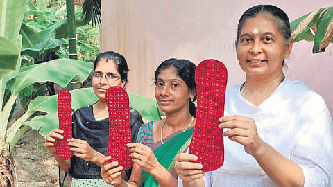 Anju Bist and her team with the world’s first reusable menstrual pads they made from banana fibre, which comes from agro-waste