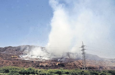 Smoke billows from the Ghazipur landfill on Tuesday, a day after the fire broke out, even as residents complain of breathing difficulties | parveen negi