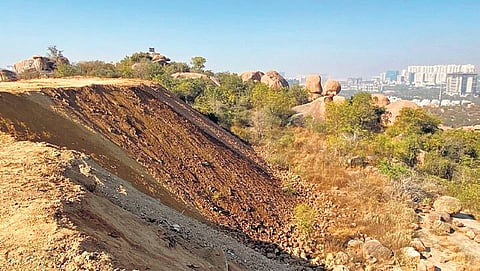 A view of the the loose soil that has covered a sizeable part of the rock formation at Khajaguda in Hyderabad on Thursday.