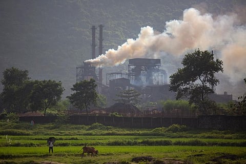 Smoke rises from a coal-powered steel plant at Hehal village near Ranchi, in eastern state of Jharkhand. ( Photo | AP)