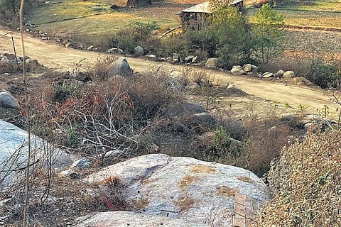 The existing pathway where activists want the proposed link road to be laid so that the prehistoric rock formations at Khajaguda are not disturbed