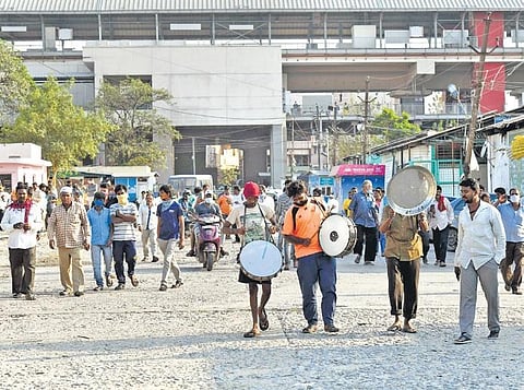 Commission agents play drums to express their joy after the High Court ordered opening of the Gaddiannaram fruit market in Hyderabad on Friday | Vinay Madapu
