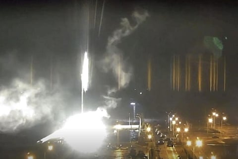 This image made from a video released by Zaporizhzhia NPP shows bright flaring object landing in grounds of the plant in Enerhodar, Ukraine following Russian shelling, Friday. (AP Photo)
