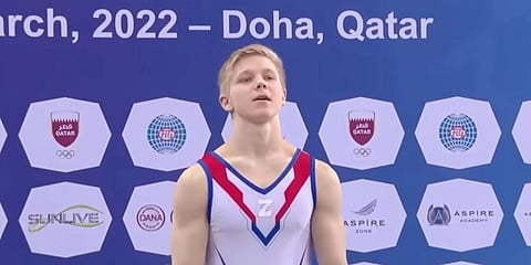 Russian gymnast Ivan Kuliak at the podium of a Gymnastics World Cup event with the letter 'Z' plastered on his chest. (Photo | YouTube screengrab)