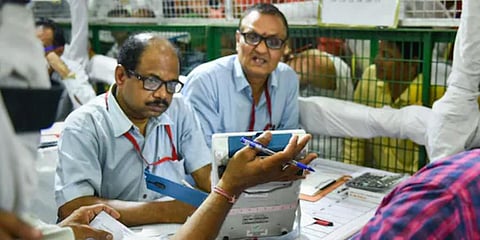 Election officials carry out counting of votes. (Photo | PTI)