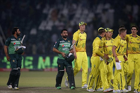 Pakistan's Iftikhar Ahmed, left, Khushdil Shah, center, and Australian players leaving the ground on end of the second ODI against Australia. (Photo | AP)
