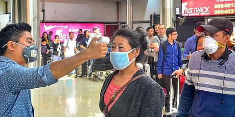 Passengers undergo a thermal screening test at Dimapur airport in Nagaland. (Photo| PTI)
