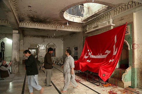 In northwest Pakistan the remains of an IS suicide bomber are still visible on the once ornate walls of a mosque where last month more than 63 worshippers died as they knelt in prayer. ( Photo | AP)