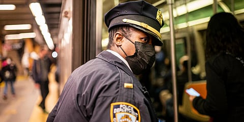 NYPD officers patrol platforms and train cars at the 36th Street subway station where a shooting attack occurred in New York.