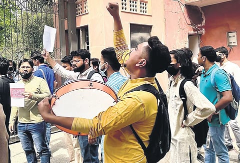 Students hold placards, raise slogans and chant songs at Jamia Millia Islamia on Tuesday morning. (Photo | shekhar yadav, EPS)