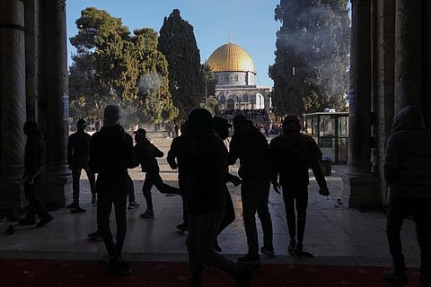 Palestinians clash with Israeli security forces at the Al Aqsa Mosque compound in Jerusalem's Old City Friday. (Photo | AP)