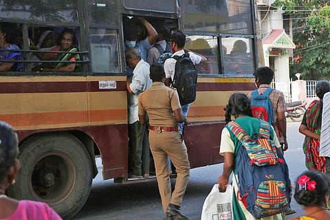 School students travelling on the footboard at Vepery in Chennai. (Photo | Sriram R, EPS)
