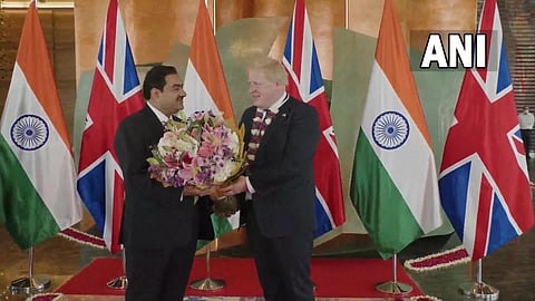 UK PM Boris Johnson meets Chairman of Adani Group, Gautam Adani, in Ahmedabad on Thursday. (Photo | ANI Twitter)