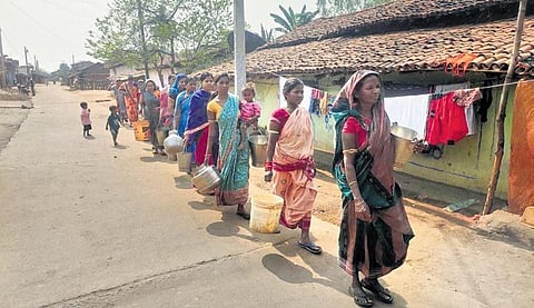 Women walk with their pitchers to collect water in Balangir’s Turekela | Express