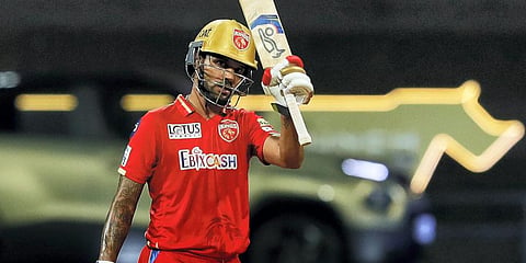 Shikhar Dhawan celebrates his half century during the IPL 2022 cricket match between Punjab Kings and Chennai Super Kings at the Wankhede Stadium, in Mumbai. (Photo | PTI)