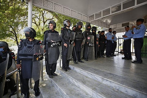 Security personnel stand guard outside the Supreme Court where the hearing of petitions for dissolving parliament by country's Prime Minister is going on, on April 7,2022(Photo | AP)