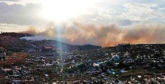Smoke emanating from the Vellalore dump yard in Coimbatore. (File photo| EPS)