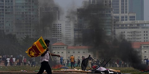 Violence erupted after supporters of Mahinda Rajapaksa attacked peaceful anti-government protesters. (Photo | AP)