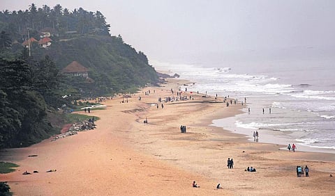 Sanitation workers remove accumulated waste at Papanasam beach Varkala as part of a cleaning drive. (Representative Image )