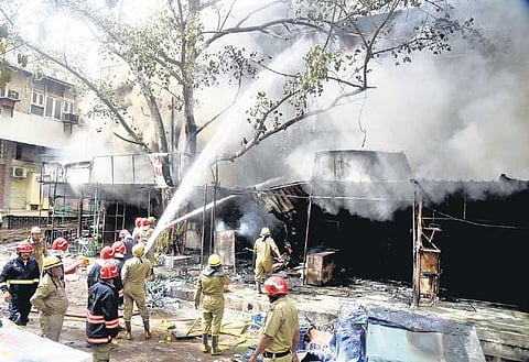Firefighters try to douse a blaze that broke out in Jhandewalans cycle market on Friday | parveen negi