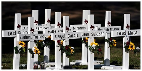 Crosses with the names of Tuesday's shooting victims are placed outside Robb Elementary School in Uvalde, Texas, Thursday, May 26, 2022. (Photo |AP)