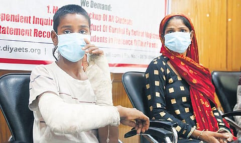 Shubham with his mother during a press conference in New Delhi | Shekhar Yadav