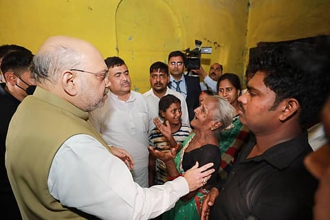 Union Home Minister Amit Shah meets the family of BJP worker Arjun Chowrasia, in Kolkata, Friday, May 6, 2022. (Photo | PTI)