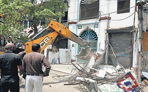 A bulldozer in action in Delhi’s Jahangirpuri area. (Photo for Representational Purpose| parveen negi)